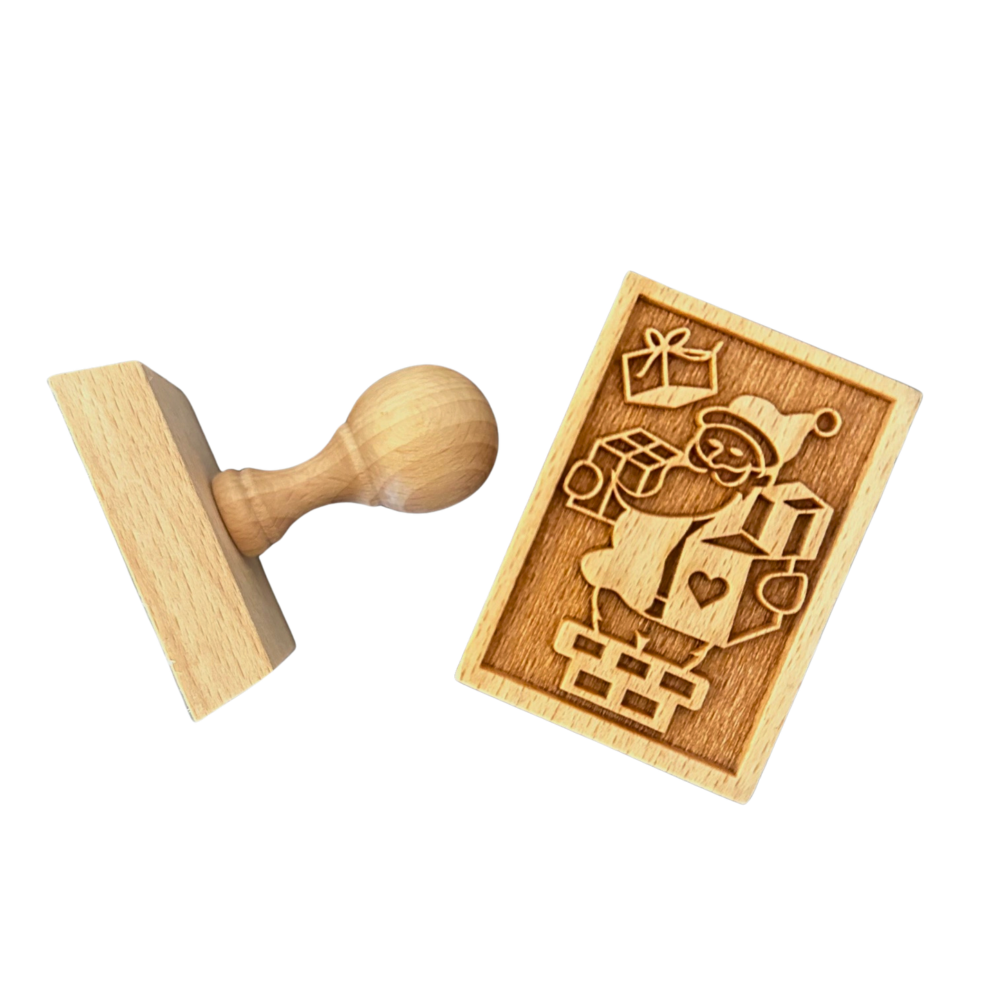 Ein Keksstempel aus Holz mit einem Weihnachtsmannmotiv.