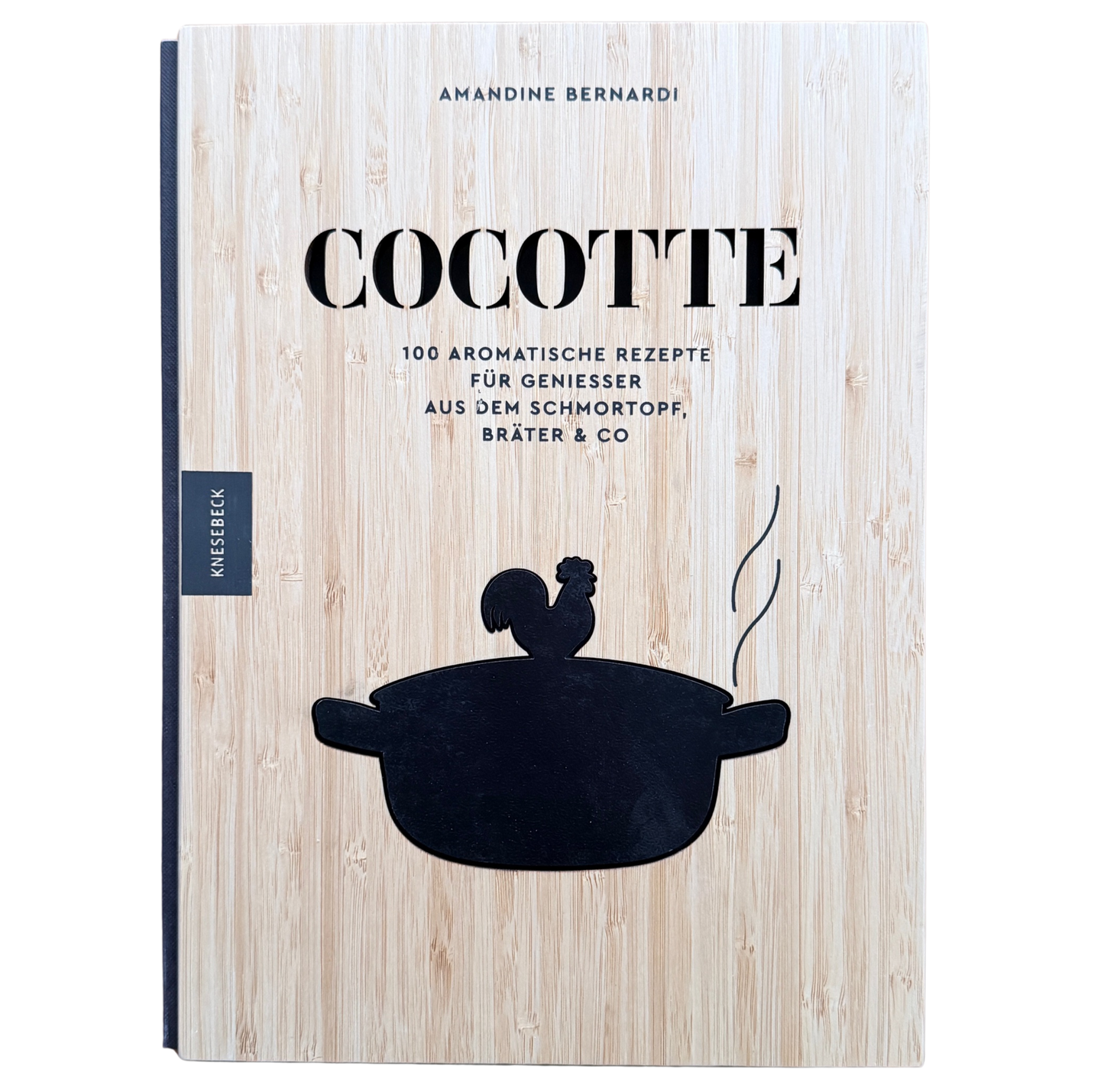 Kochbuch mit Schmortopfgerichten mit einem Holzeinband und einem schwarzen Schmortopf auf den Cover. 