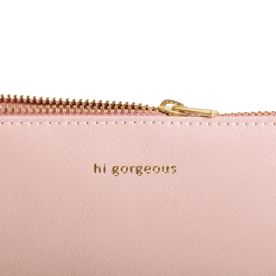 Rosa Kosmetiktasche aus Leder mit Aufschrift wunderschön.