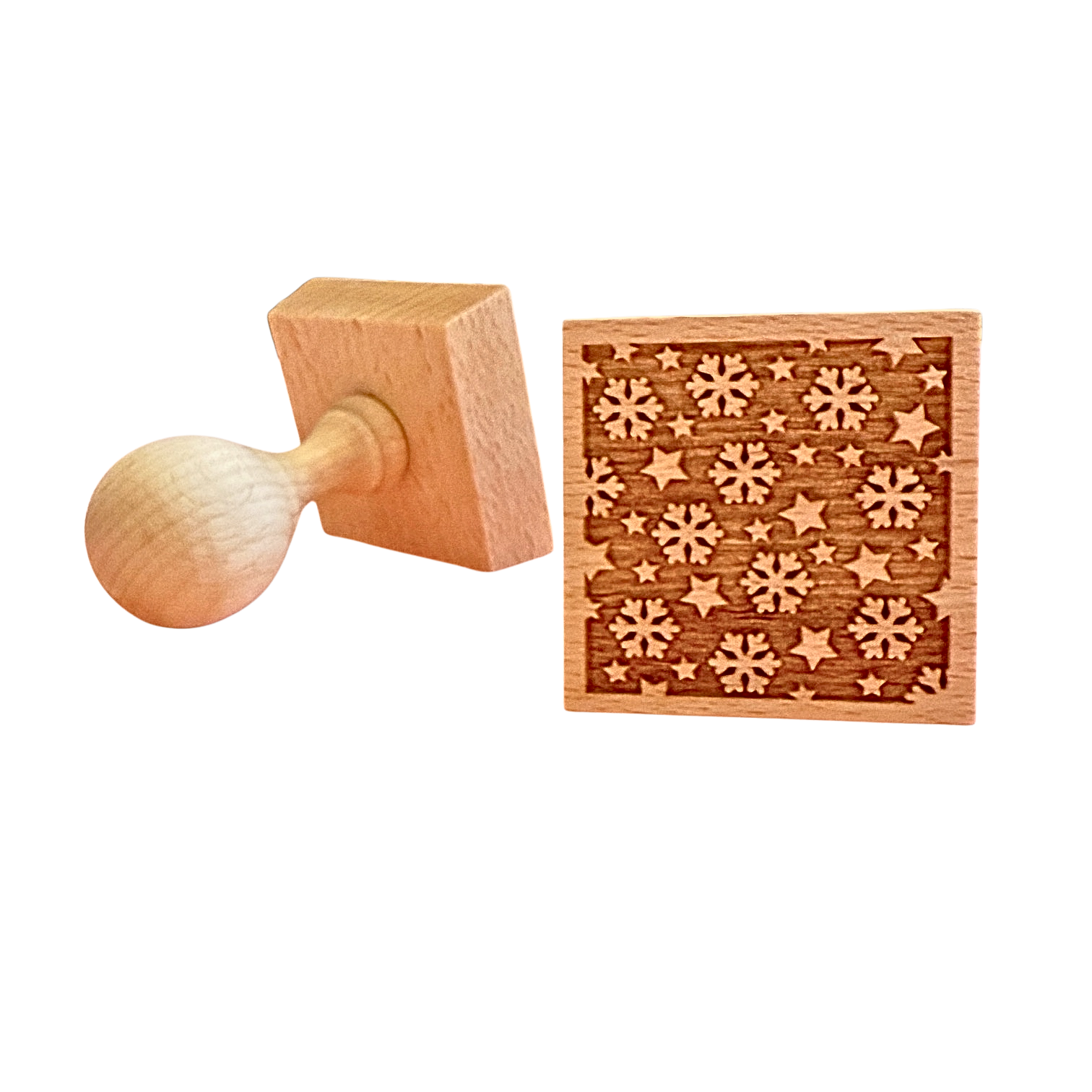 Keksstempel aus Holz mit Schneeflocken Motiv.