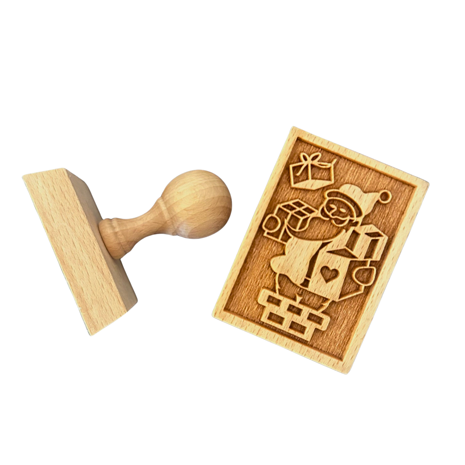 Ein Keksstempel aus Holz mit einem Weihnachtsmannmotiv.