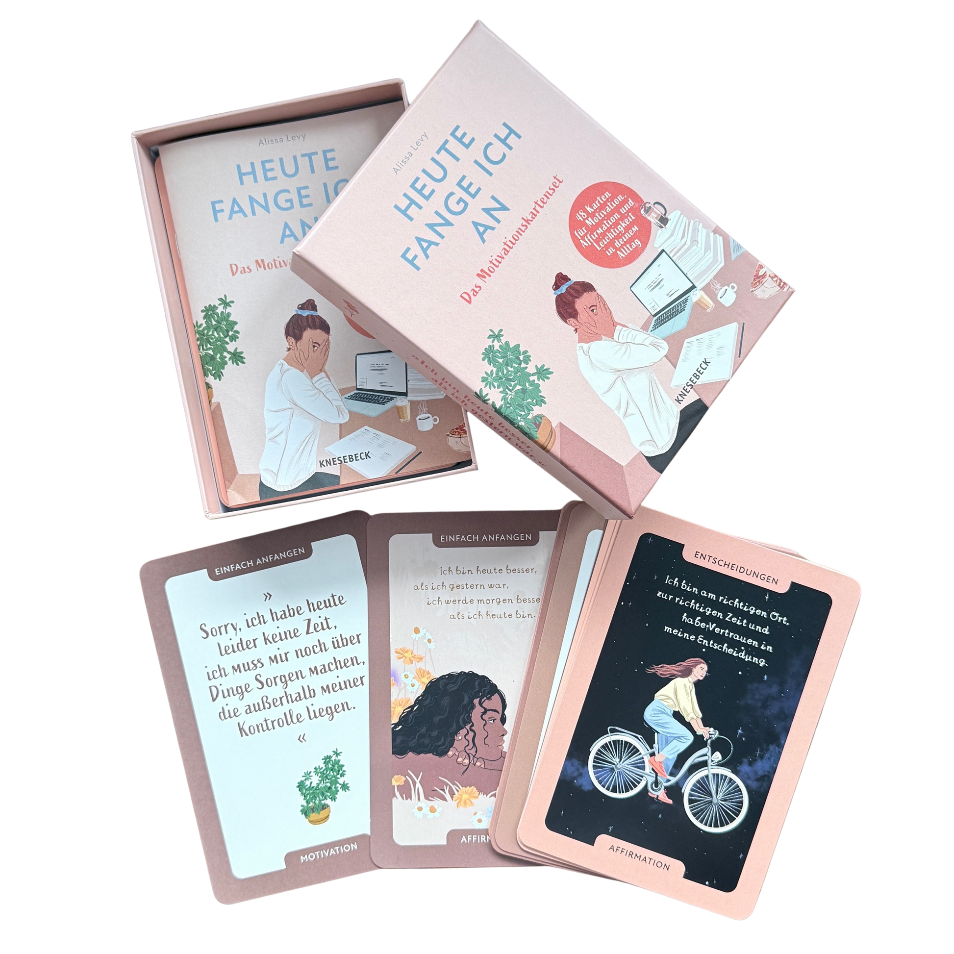 Motivationskartenset für Frauen. Eine geöffnete Schachtel aus Karton in rosa mit verschiedenen Motivationskarten.