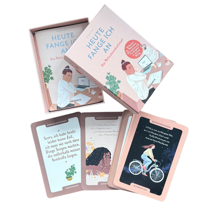 Motivationskartenset für Frauen. Eine geöffnete Schachtel aus Karton in rosa mit verschiedenen Motivationskarten.