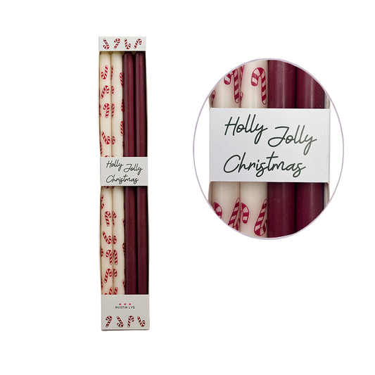 Vier Kerzen im Candy Style. Zwei in Dunkelrot und zwei in weiß mit roten Zuckerstangen. 