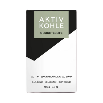 Schwarze Aktivkohleseife in einer schwarz-weißen Verpackung.