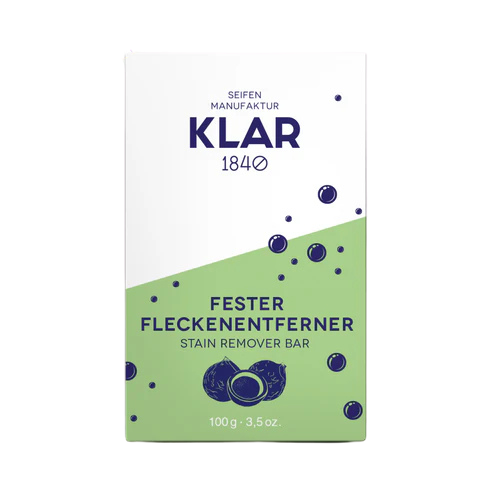 Fester Fleckenentferner in einer grün-weißen Verpackung aus Karton.