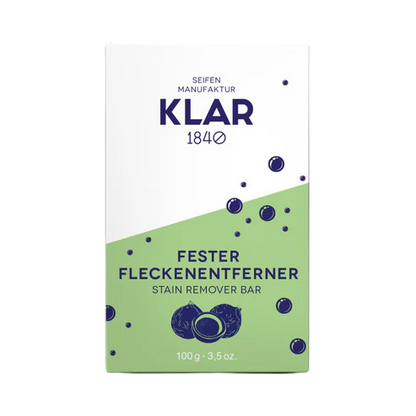 Fester Fleckenentferner in einer grün-weißen Verpackung aus Karton.