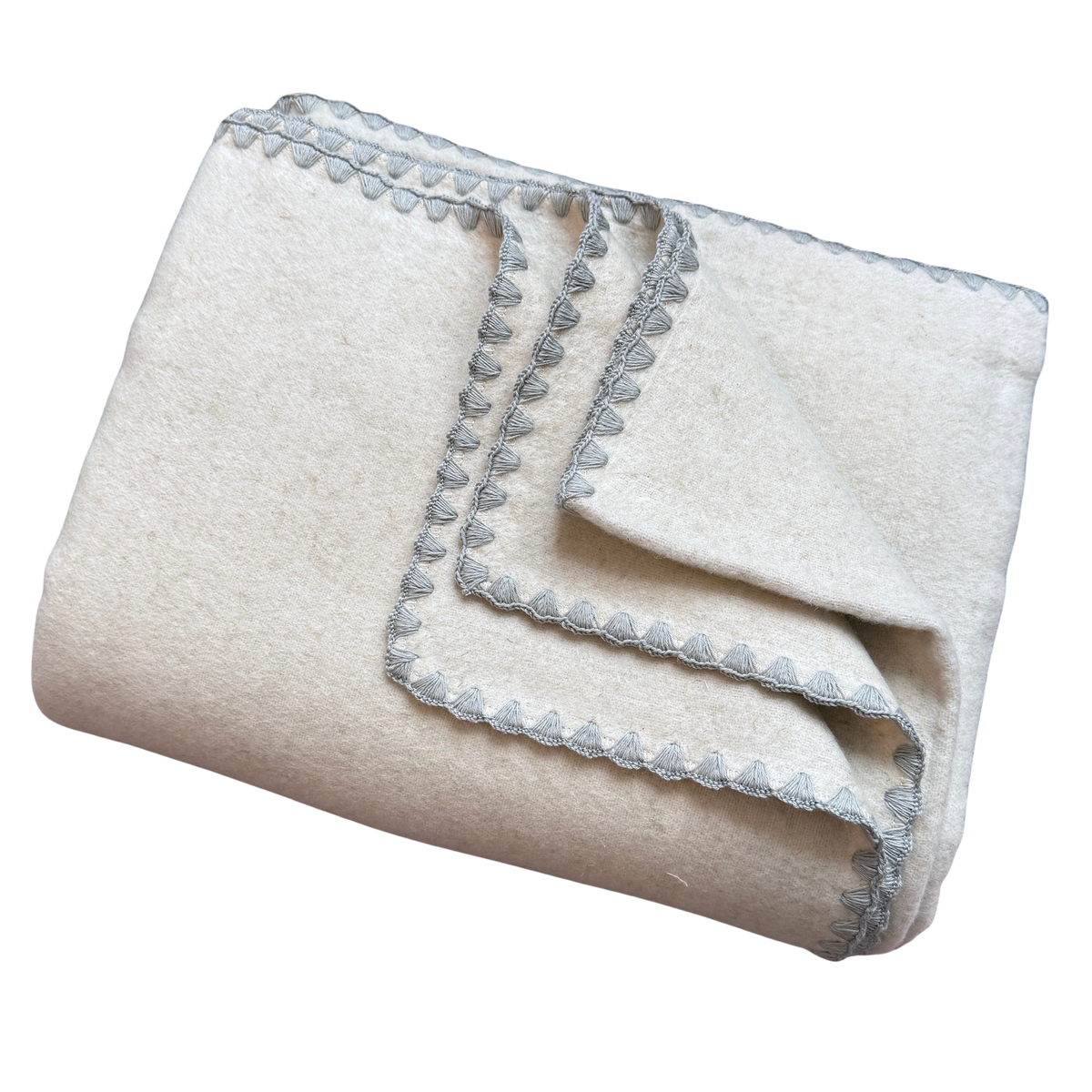 Kuscheldecke aus Baumwolle und Leinen in Beige mit einem grauen Zierrand.