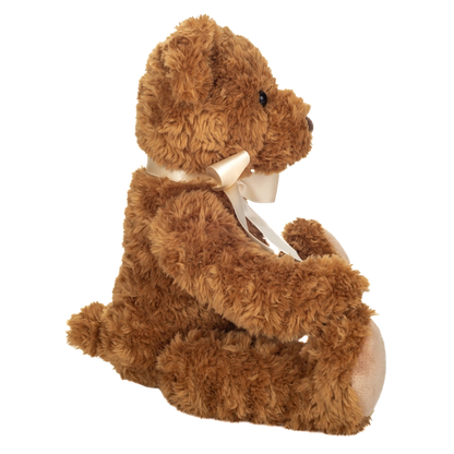 Teddy Kuscheltier in Hellbraun mit einer hellen Satinschleife - sitzend. 