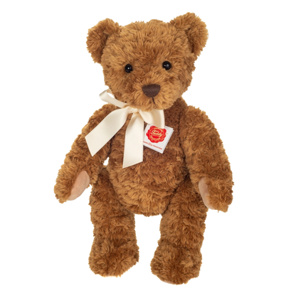 Teddy Kuscheltier in Hellbraun mit einer hellen Satinschleife.