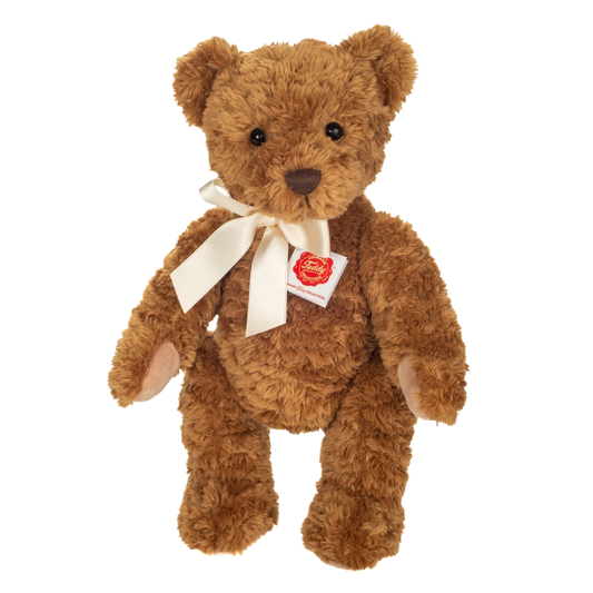 Teddy Kuscheltier in Hellbraun mit einer hellen Satinschleife.