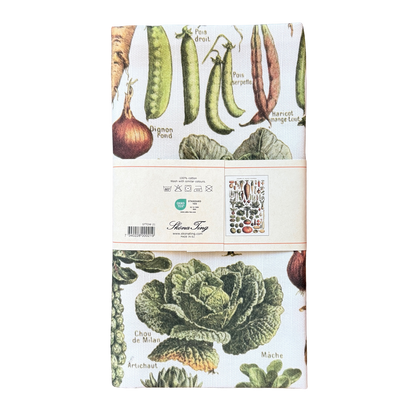 Geschirrtuch aus Baumwolle mit vielen Gemüsesorten darauf. 