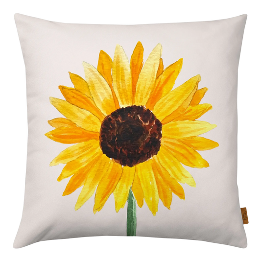 Ein Kissenbezug aus Velours in beige mit einer grlßen gelben Sonnenblumenblüte darauf.